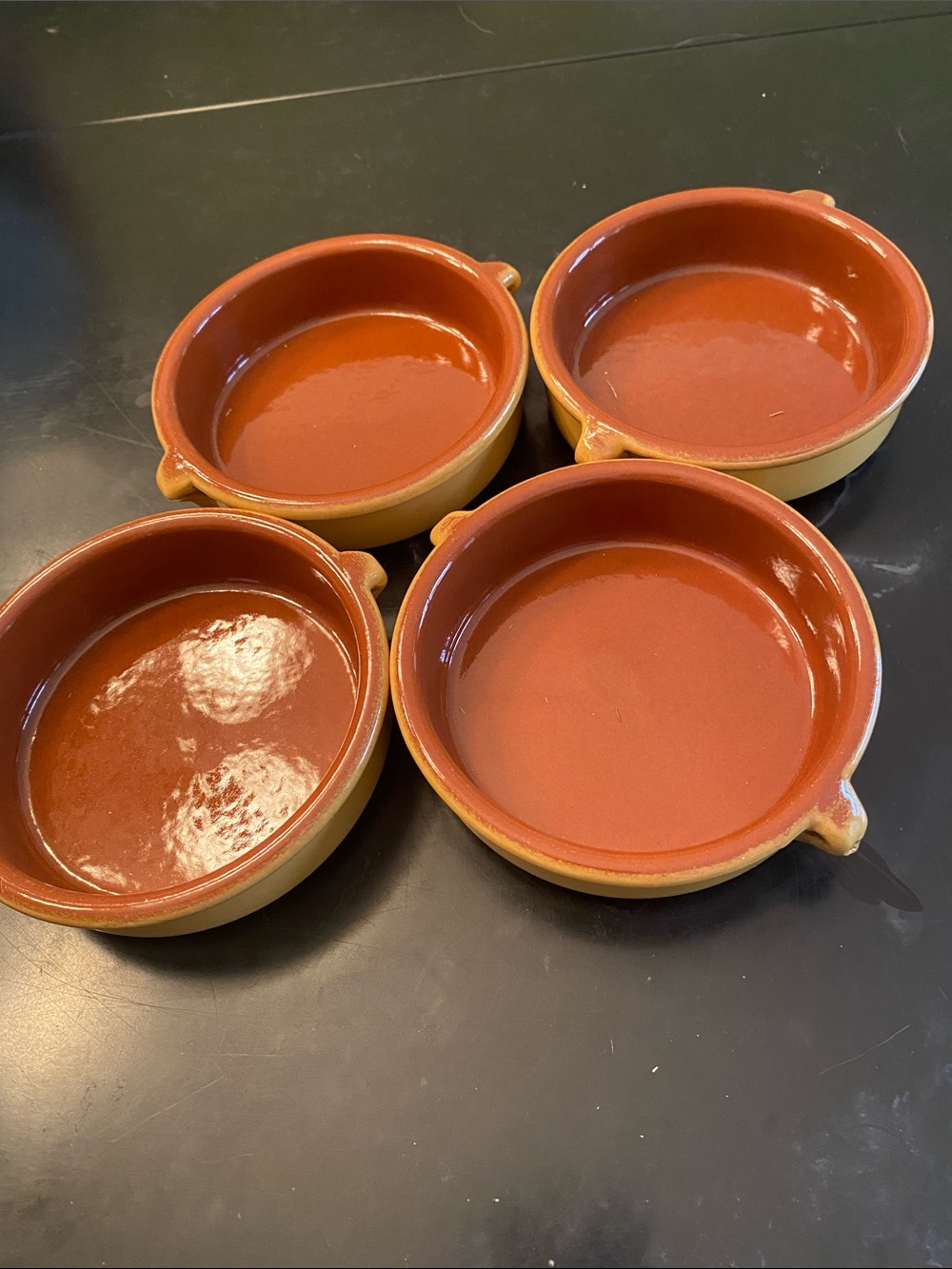Set of 4 Rustic mustard yellow Glazed cazuelas, perfect for serving tapas.